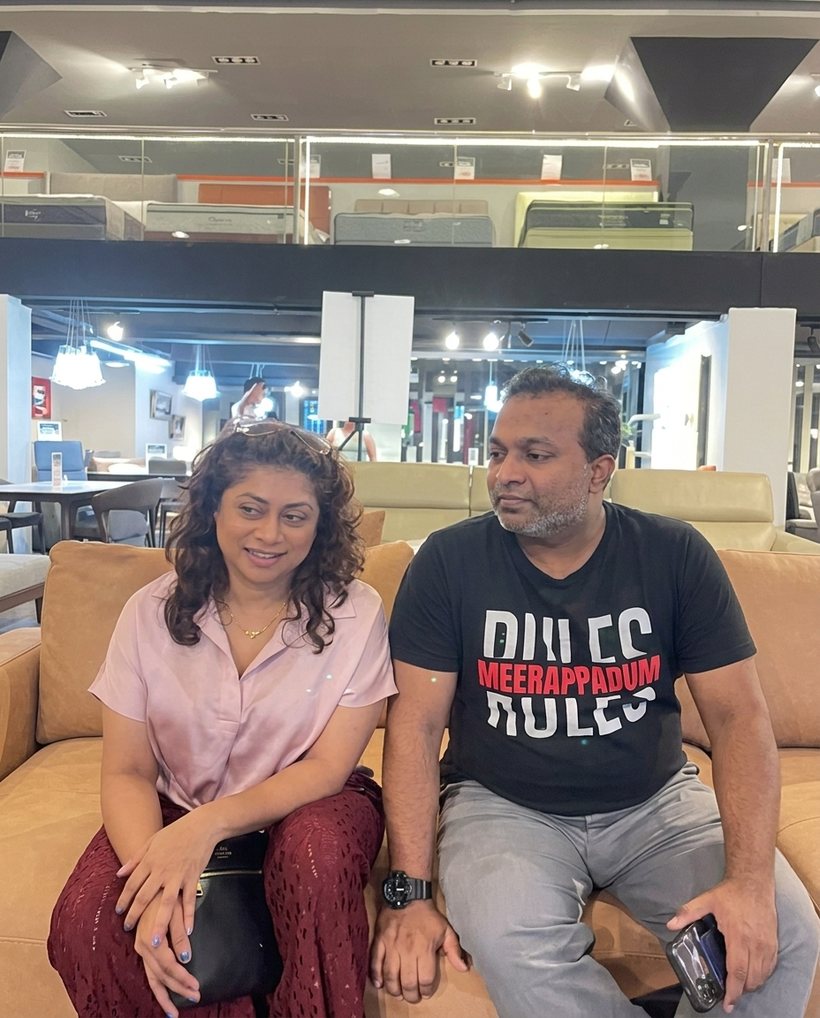 Happy customers at the Furniture Depot showroom